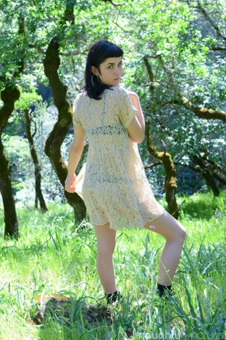 Adorable amateur babe Myre strips in an orchard and shows her hairy armpits
