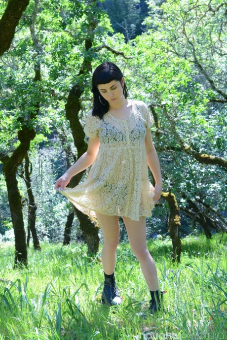 Adorable amateur babe Myre strips in an orchard and shows her hairy armpits