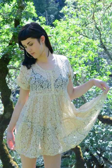 Adorable amateur babe Myre strips in an orchard and shows her hairy armpits