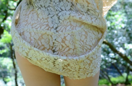 Adorable amateur babe Myre strips in an orchard and shows her hairy armpits
