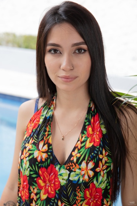 Brunette teen Kiki Cash doffs her dress and flaunts her incredible big boobs