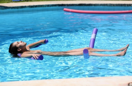 Redheaded Czech babe Chrissy Fox gives head during a naked swimming session