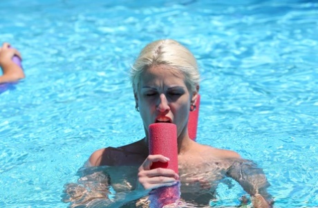 Redheaded Czech babe Chrissy Fox gives head during a naked swimming session