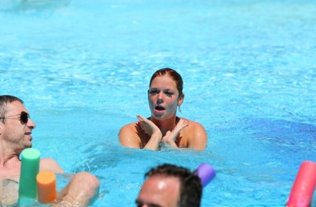 Redheaded Czech babe Chrissy Fox gives head during a naked swimming session