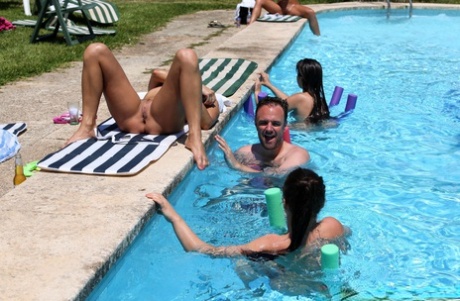Redheaded Czech babe Chrissy Fox gives head during a naked swimming session