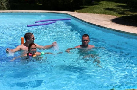 Redheaded Czech babe Chrissy Fox gives head during a naked swimming session