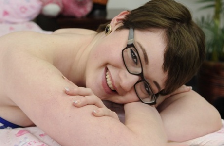 Short-haired nerd Emma Snow stripping and giving a sloppy handjob in POV
