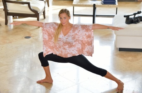 Busty beauty Courtney reveals her amazing curves while stretching on the floor