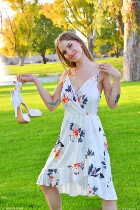 Cute amateur Octavia flashes her big tits outdoors and goes topless at home