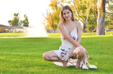 Cute amateur Octavia flashes her big tits outdoors and goes topless at home