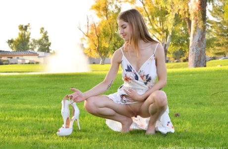 Cute amateur Octavia flashes her big tits outdoors and goes topless at home