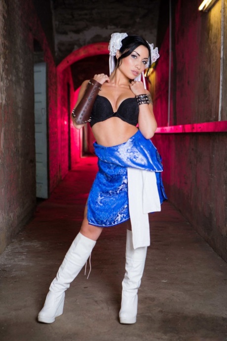 Petite South Korean teen Rina Ellis loses her costume and poses in her boots