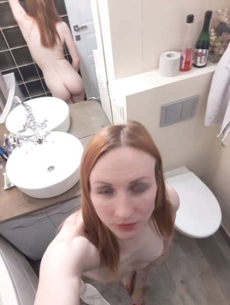 Amateur ginger flaunting her small boobs and skinny body in the mirror