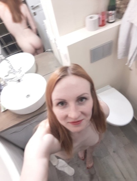 Amateur ginger flaunting her small boobs and skinny body in the mirror