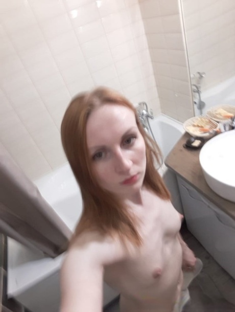 Amateur ginger flaunting her small boobs and skinny body in the mirror