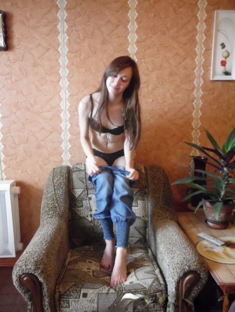 Skinny all-natural brunette poses naked before putting her clothes on