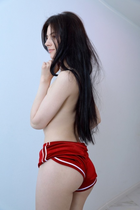 Sexy brunette babe Aleksandrina shows off her hot ass and her shaved pussy