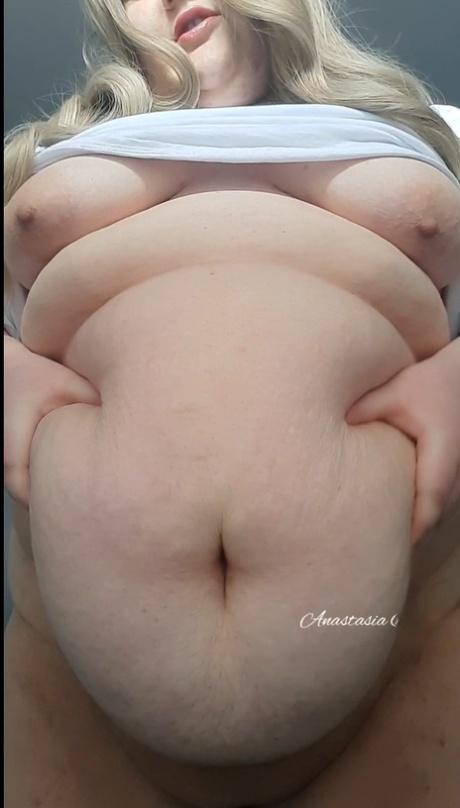 Fat blonde mature Anastasia Gree teases with her huge saggy tits in a solo