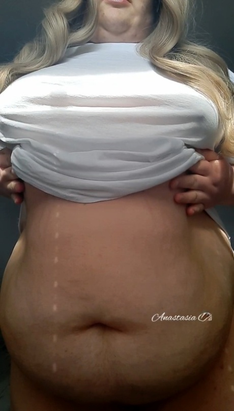 Fat blonde mature Anastasia Gree teases with her huge saggy tits in a solo