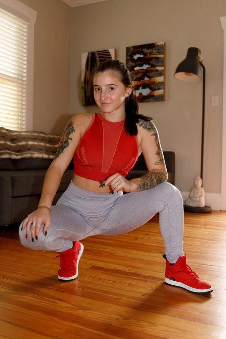 Cute amateur babe Sasha Apex loses her sportswear and shows her inked body