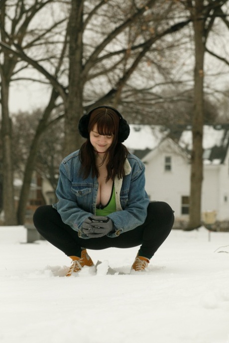 Amateur babe Daisy Wensday displays her amazing juggs and big ass in the snow