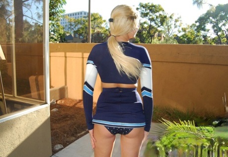 Beautiful schoolgirl shows off her hot ass & her bald cunt outdoors