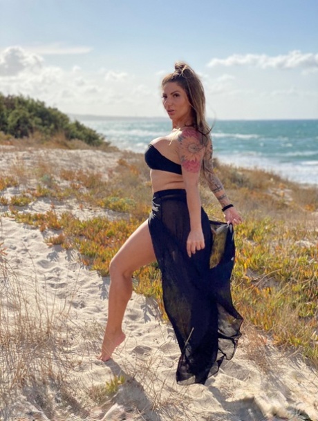 Inked Italian slut Lily Veroni wanks a dick with her big tits & sucks it