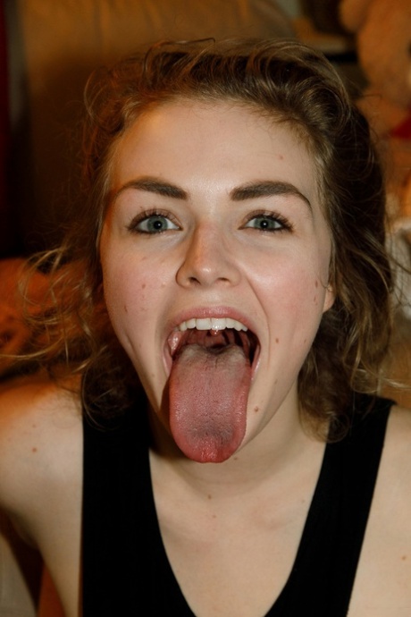 Cute amateur girlfriend Kat Keen shows her pussy and long tongue in a solo