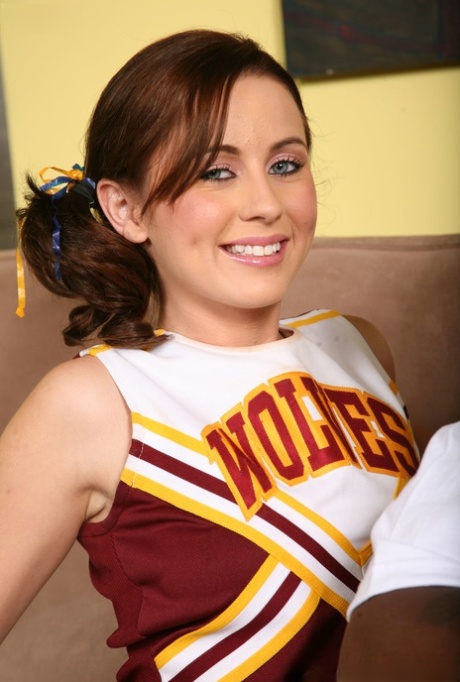 Redhead cheerleader Mae Meyers gives a footjob to a big dicked ghetto dude