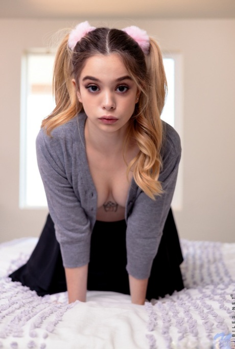 Little pigtailed schoolgirl Molly Little undresses and plays with her muff