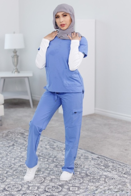 Naughty Latina nurse Penelope Woods shows her amazing ass and hot figure