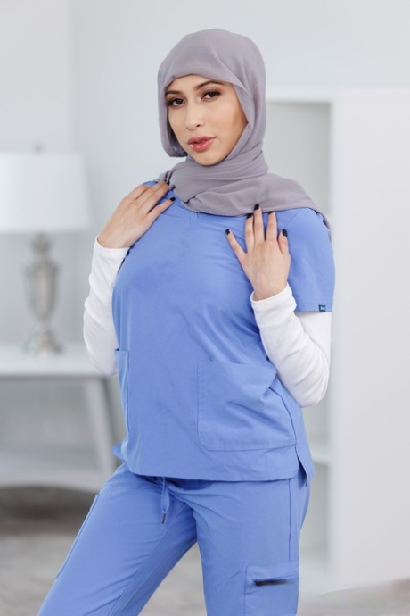 Naughty Latina nurse Penelope Woods shows her amazing ass and hot figure