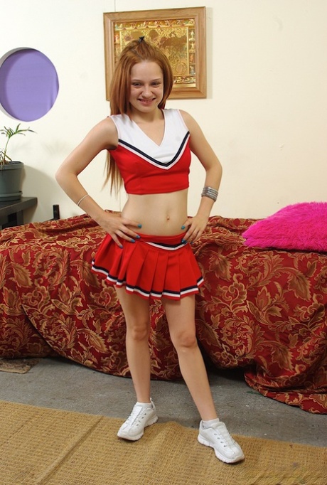 Redheaded cheerleader Jennifer Anderson gets fucked in an IR gangbang