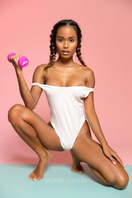 Adorable ebony teases with her perfect fake tits and amazing ass on a yoga mat