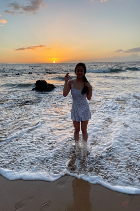 Asian teen Alexia Anders poses naked on the beach & spreads her twat up close