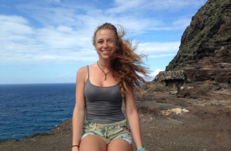 Amateur girlfriend Taylor Whyte poses in a tight shirt & shorts by the sea