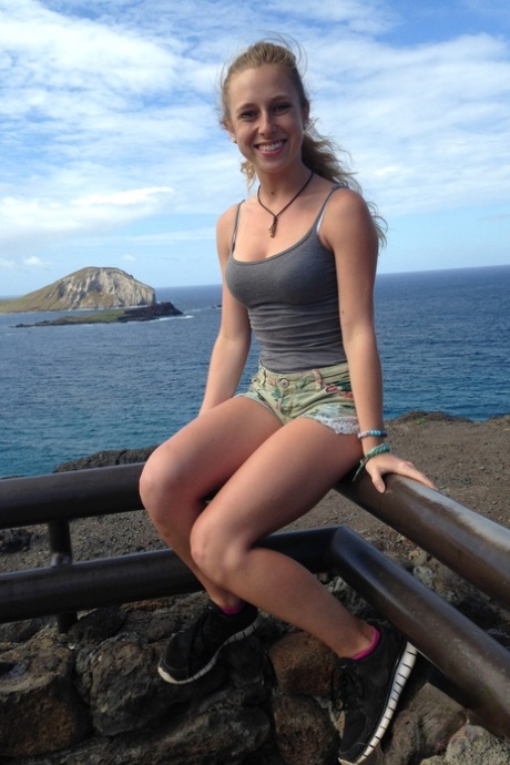 Amateur girlfriend Taylor Whyte poses in a tight shirt & shorts by the sea