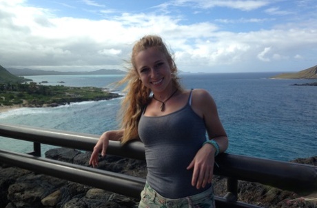 Amateur girlfriend Taylor Whyte poses in a tight shirt & shorts by the sea