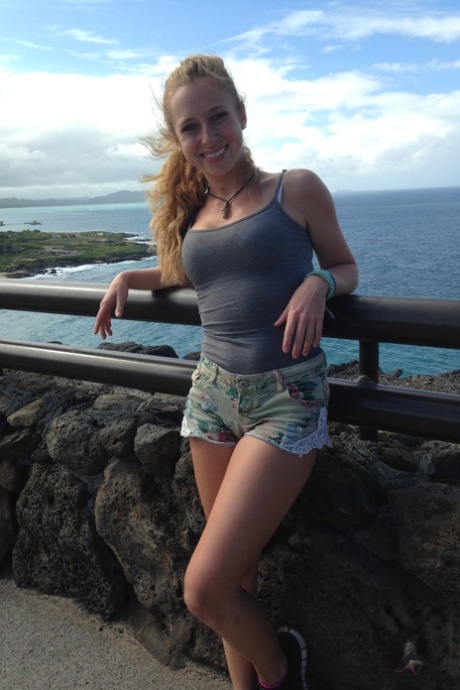 Amateur girlfriend Taylor Whyte poses in a tight shirt & shorts by the sea