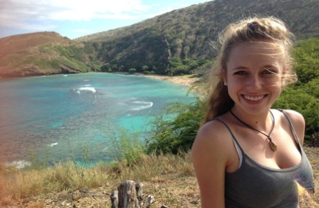 Amateur girlfriend Taylor Whyte poses in a tight shirt & shorts by the sea