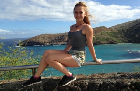Amateur girlfriend Taylor Whyte poses in a tight shirt & shorts by the sea