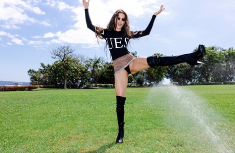 Slim teen Irene Rouse flashes her ass while showing her flexibility in public