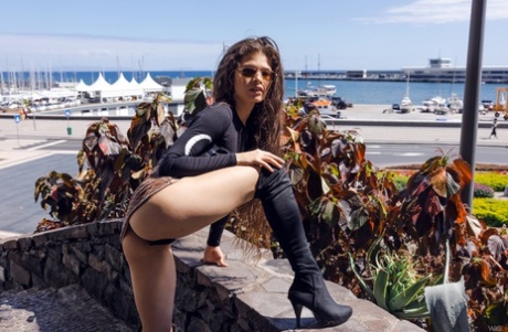 Slim teen Irene Rouse flashes her ass while showing her flexibility in public