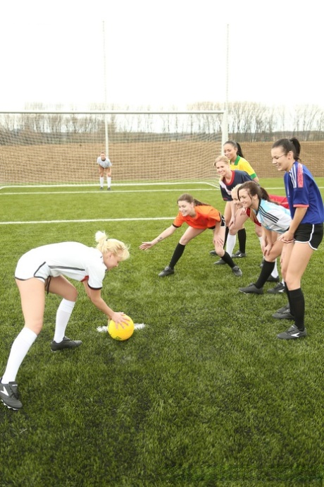 Soccer girls show their bodies at the field before lesbian orgy in a shower