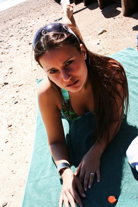Sexy wife in a bikini Claudia Rossi shows her tiny tits at the beach