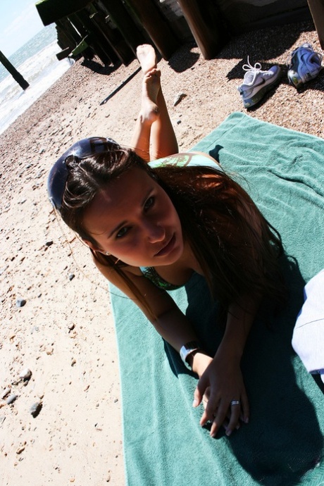 Sexy wife in a bikini Claudia Rossi shows her tiny tits at the beach