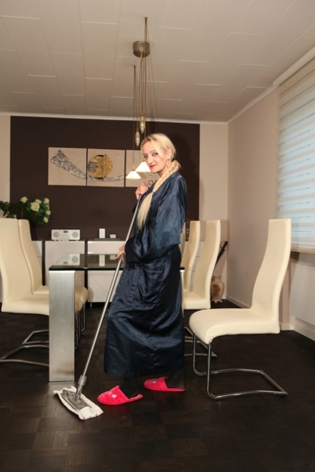 Hot housewife Adrienne Kiss teases in sexy lingerie while doing housework