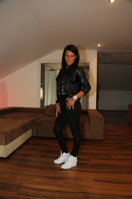 Little brunette Maria Fiori posing in her cute black outfit in a solo