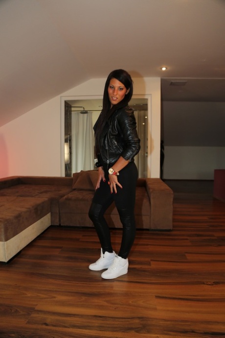 Little brunette Maria Fiori posing in her cute black outfit in a solo