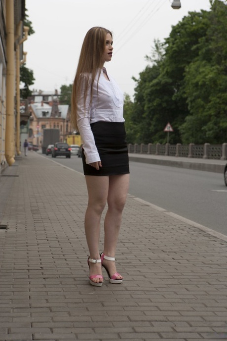 German babe Jenny Lo flaunts her hot legs wearing a miniskirt & high heels